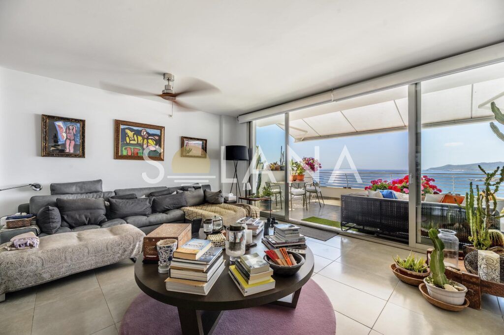 Open-plan living and dining room with terrace access