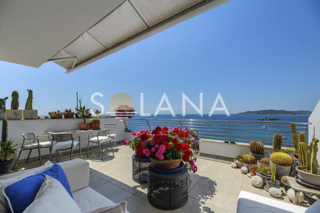 Covered terrace lounge with Ibiza bay views