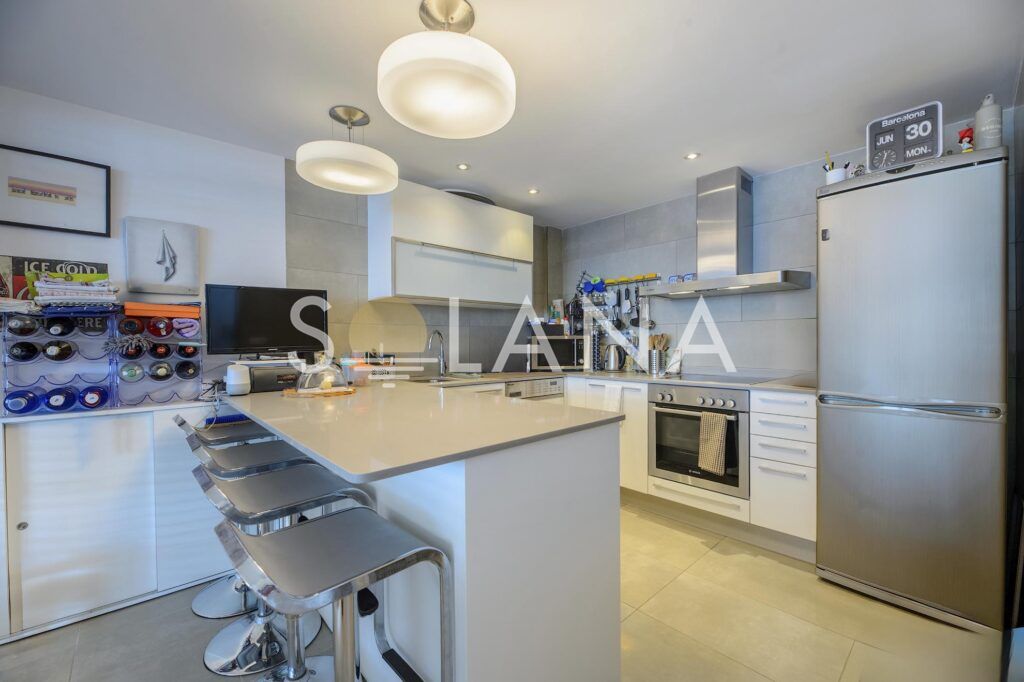 Bright lounge area with dining table and large windows