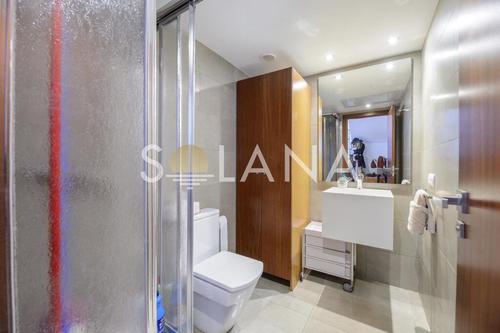 Bathroom with shower, vanity and toilet