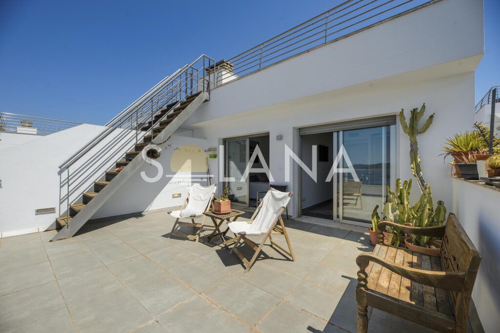 Terrace with loungers and staircase access